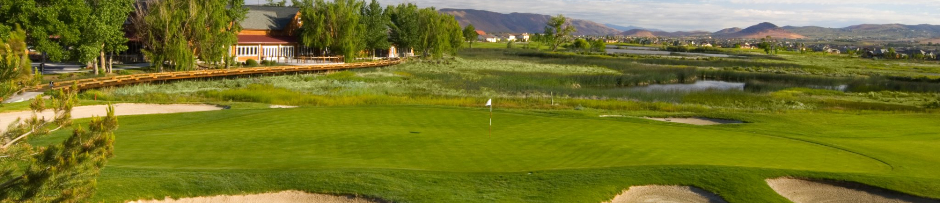 Image of golf ball on tee on grass.